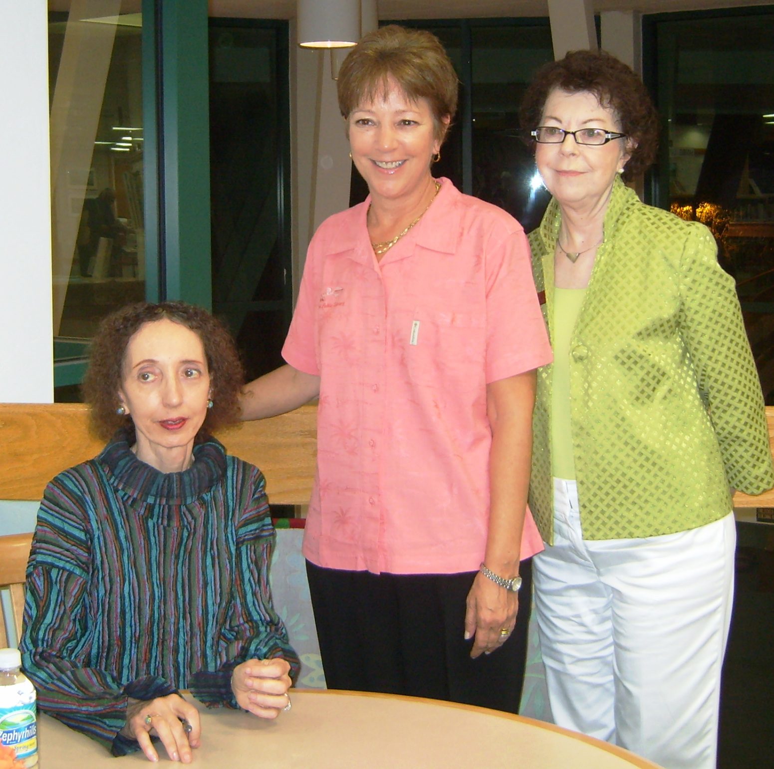 three women, author is seated